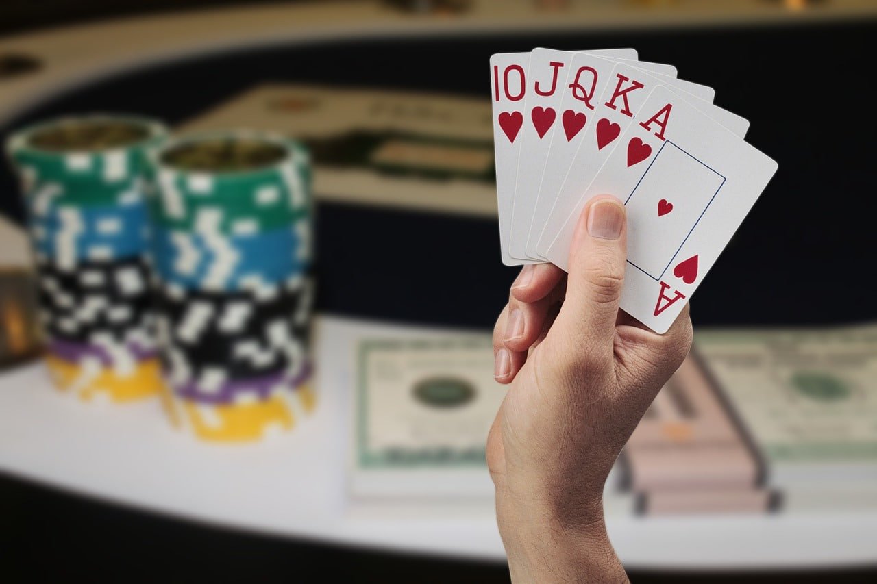 Mobile phone displaying sortoto slot Monopoly Live interface